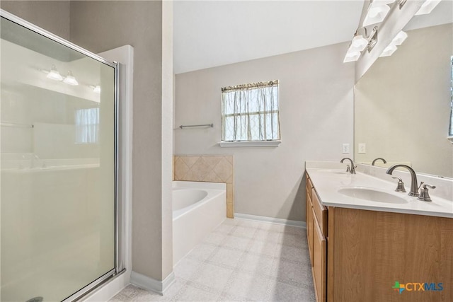 816 Woodhollow Dr, Temple, TX 76502 - bathroom featuring a garden tub, a shower stall, double vanity, and tile patterned floors