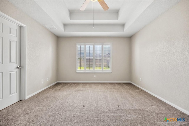 816 Woodhollow Dr, Temple, TX 76502 - carpeted empty room with a raised ceiling and a ceiling fan