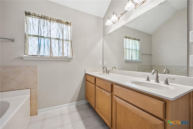 816 Woodhollow Dr, Temple, TX 76502 - full bathroom featuring lofted ceiling, a garden tub, and double vanity