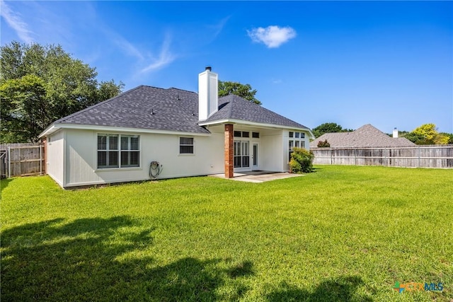 816 Woodhollow Dr, Temple, TX 76502 - rear view of house with a fenced backyard, a patio area, roof with shingles, a chimney, and stucco siding