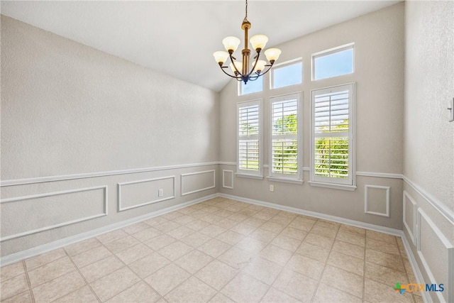 816 Woodhollow Dr, Temple, TX 76502 - spare room with a chandelier, lofted ceiling, a wainscoted wall, and a decorative wall