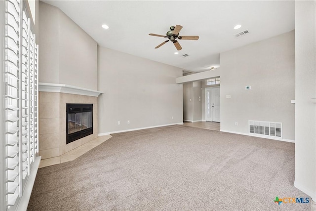 816 Woodhollow Dr, Temple, TX 76502 - unfurnished living room with carpet flooring, a tile fireplace, a ceiling fan, and recessed lighting