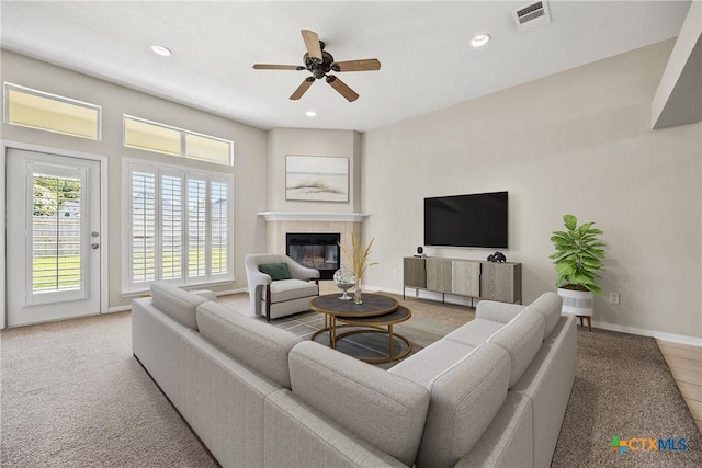 816 Woodhollow Dr, Temple, TX 76502 - living room with ceiling fan, a tile fireplace, recessed lighting, and light carpet