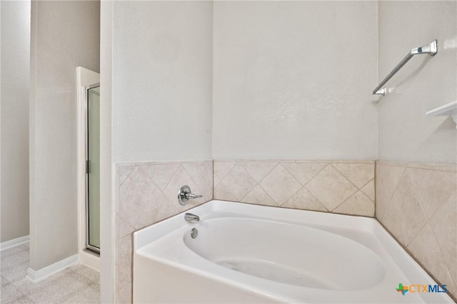 816 Woodhollow Dr, Temple, TX 76502 - bathroom featuring a bath and a shower stall