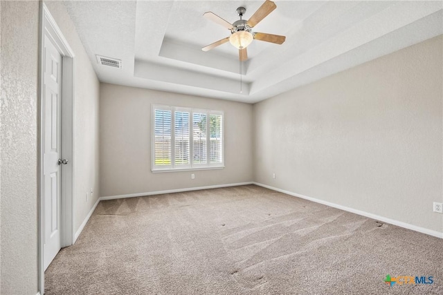 816 Woodhollow Dr, Temple, TX 76502 - carpeted spare room featuring a tray ceiling and a ceiling fan