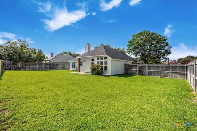 816 Woodhollow Dr, Temple, TX 76502 - back of house with a fenced backyard and a chimney
