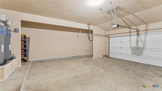 garage with electric water heater and a garage door opener