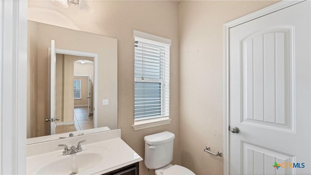 bathroom featuring vanity and toilet