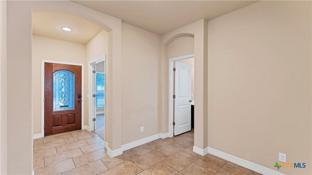 entrance foyer with light tile patterned flooring