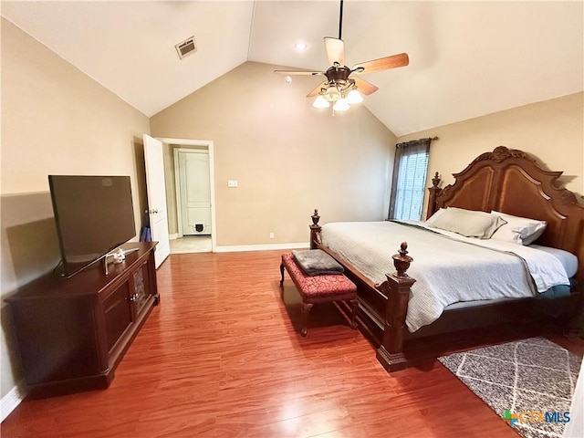 bedroom featuring ceiling fan, vaulted ceiling, and hardwood / wood-style floors