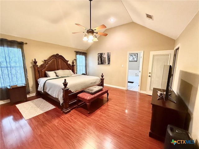 bedroom with lofted ceiling, hardwood / wood-style floors, and ceiling fan