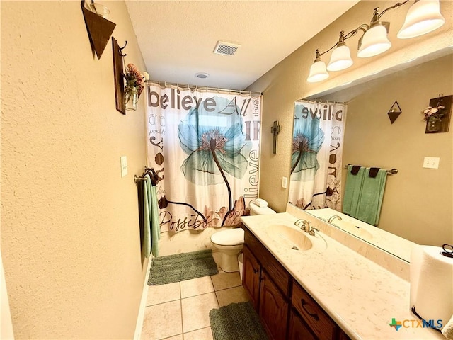 full bathroom with vanity, a textured ceiling, tile patterned floors, toilet, and shower / bath combo with shower curtain