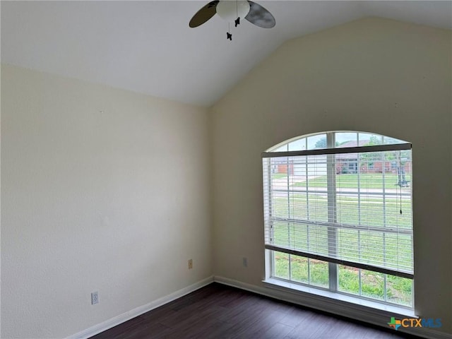 unfurnished room with plenty of natural light, ceiling fan, dark wood finished floors, and lofted ceiling