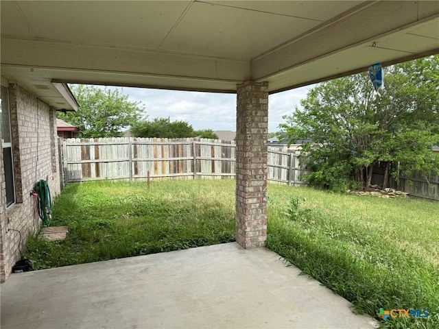 view of yard featuring a patio area and a fenced backyard