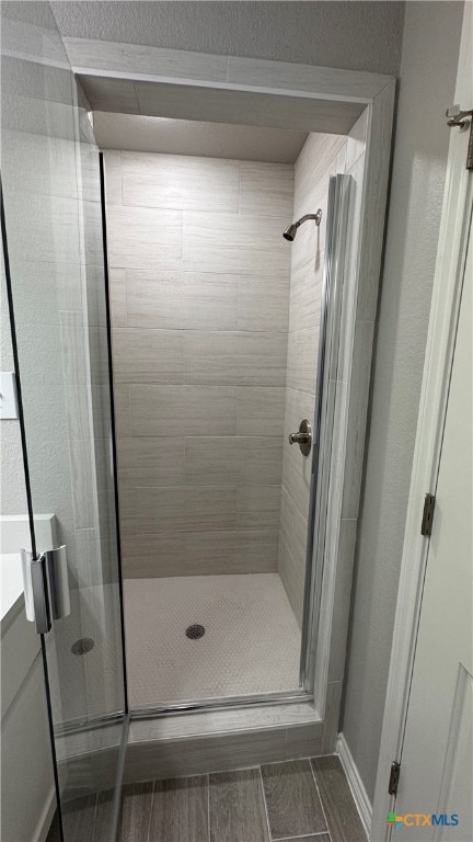 bathroom with an enclosed shower