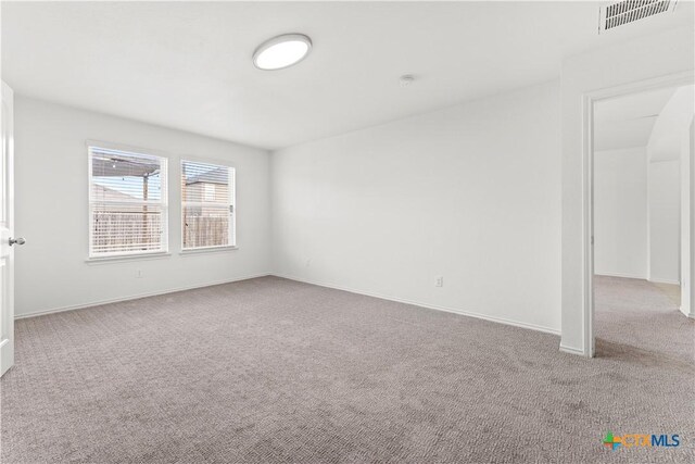 1032 Sandwell Ct, Seguin, TX 78155 - spare room with baseboards, carpet flooring, and visible vents