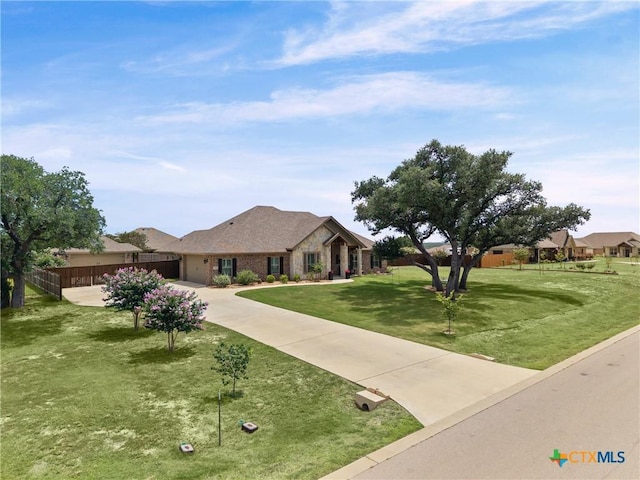 3631 Morgan Mill Rd, Kempner, TX 76539 - ranch-style home featuring driveway, a garage, and stone siding