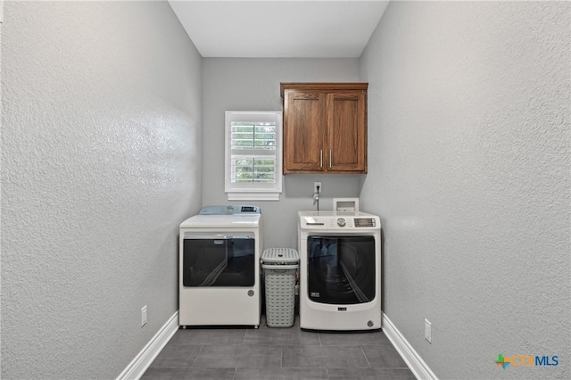 3631 Morgan Mill Rd, Kempner, TX 76539 - laundry area with cabinet space, washing machine and clothes dryer, and a textured wall