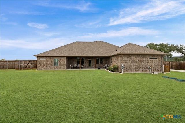 3631 Morgan Mill Rd, Kempner, TX 76539 - rear view of house featuring brick siding, a fenced backyard, a patio, and a shingled roof