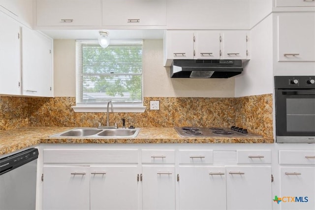 2410 Meadow Ln, Copperas Cove, TX 76522 - kitchen with stainless steel appliances, under cabinet range hood, white cabinetry, and tasteful backsplash