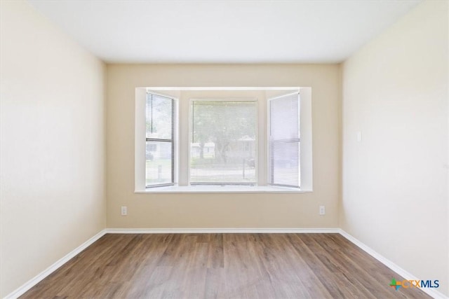 2410 Meadow Ln, Copperas Cove, TX 76522 - spare room with wood finished floors and baseboards