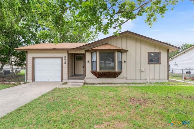 2410 Meadow Ln, Copperas Cove, TX 76522 - single story home with board and batten siding, an attached garage, and driveway
