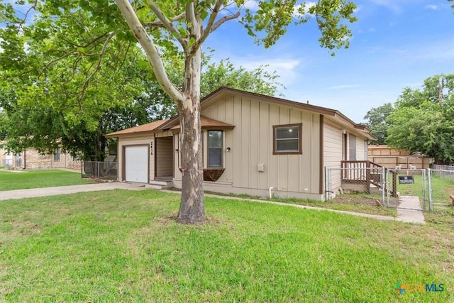 2410 Meadow Ln, Copperas Cove, TX 76522 - ranch-style house with board and batten siding, a gate, concrete driveway, and an attached garage