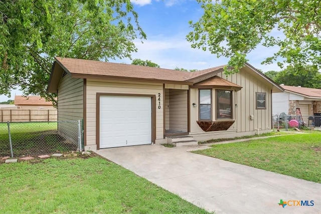 2410 Meadow Ln, Copperas Cove, TX 76522 - view of front of house featuring board and batten siding, concrete driveway, and a garage