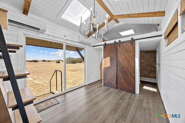 51 Private Road 901, Florence, TX 76527 - unfurnished sunroom with a barn door, a chandelier, and a wall mounted AC