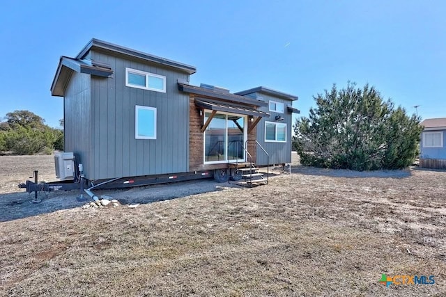 51 Private Road 901, Florence, TX 76527 - rear view of house with entry steps