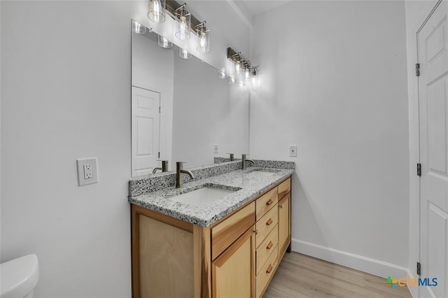 51 Private Road 901, Florence, TX 76527 - bathroom with double vanity and wood finished floors