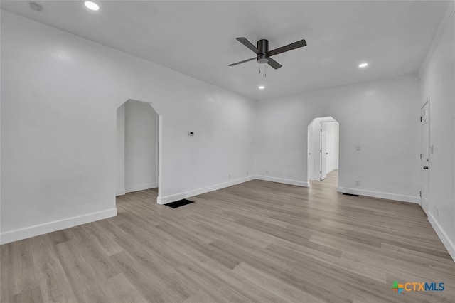 51 Private Road 901, Florence, TX 76527 - unfurnished room with arched walkways, ceiling fan, recessed lighting, and light wood finished floors
