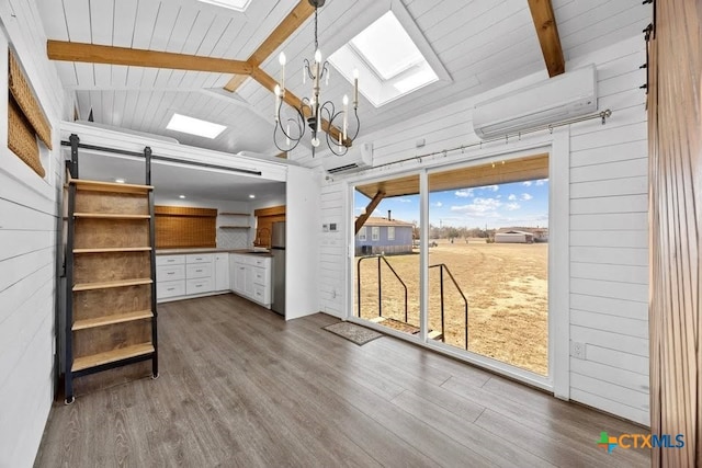 51 Private Road 901, Florence, TX 76527 - unfurnished sunroom featuring a barn door, a chandelier, a skylight, and a wall unit AC