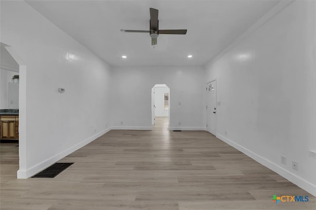 51 Private Road 901, Florence, TX 76527 - unfurnished room with arched walkways, ceiling fan, light wood-style floors, and recessed lighting
