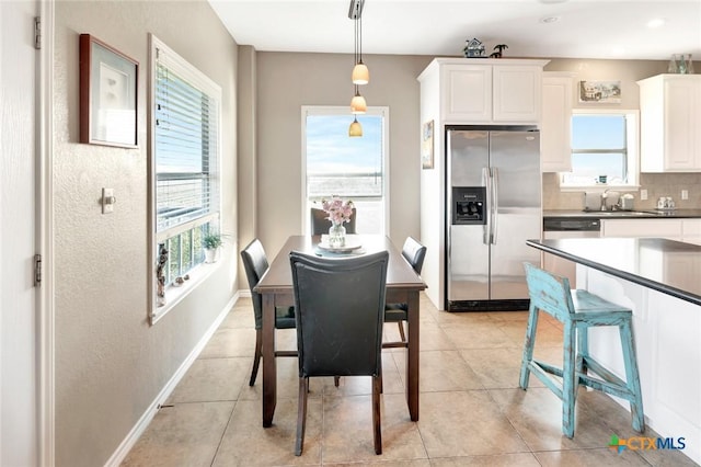 314 Windswept Dr, Port Lavaca, TX 77979 - dining space with light tile patterned floors