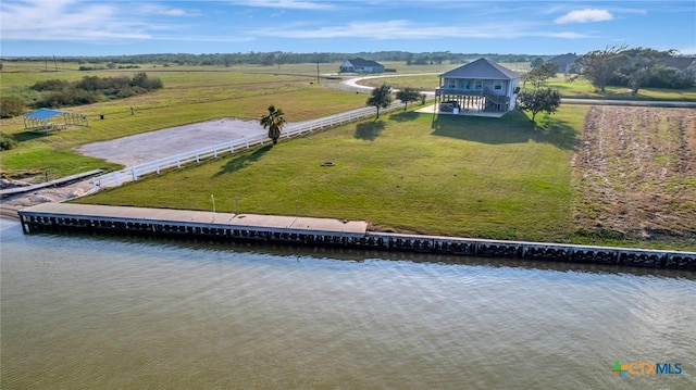 drone / aerial view with a rural view and a water view