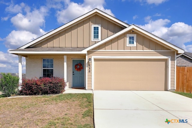 view of front of house featuring a garage and a porch