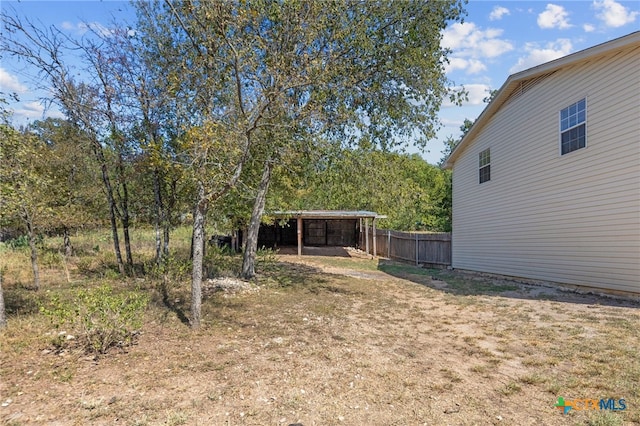 view of yard with a carport