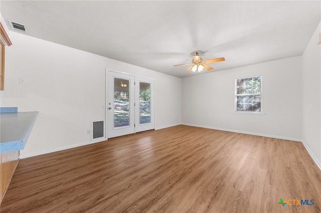 unfurnished room featuring hardwood / wood-style flooring and ceiling fan