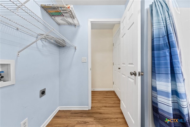 laundry area featuring hookup for a washing machine, hardwood / wood-style flooring, and hookup for an electric dryer