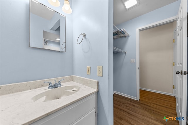 bathroom featuring hardwood / wood-style floors and vanity