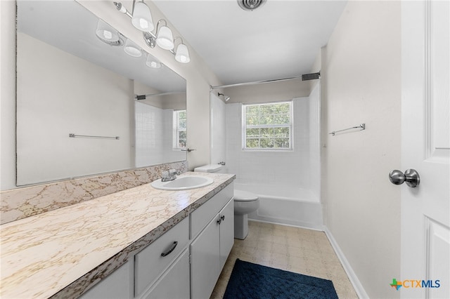 full bathroom with vanity, toilet, and tiled shower / bath