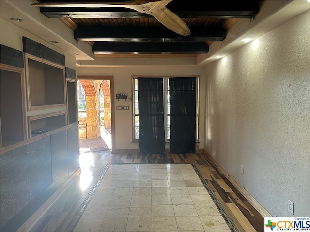 interior space with wood ceiling and beam ceiling