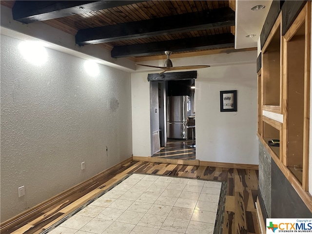 interior space featuring stainless steel refrigerator, wood ceiling, and wood-type flooring