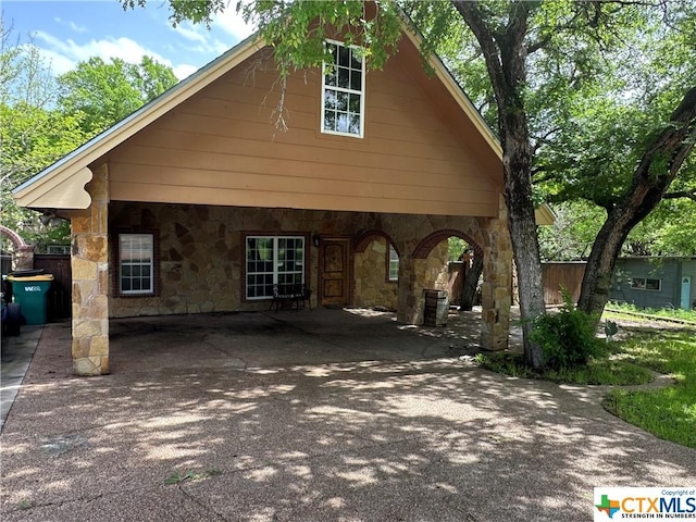 exterior space with a carport