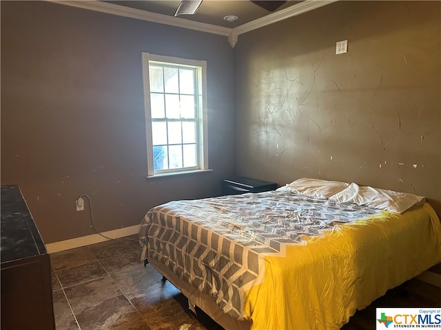 bedroom with ceiling fan and ornamental molding