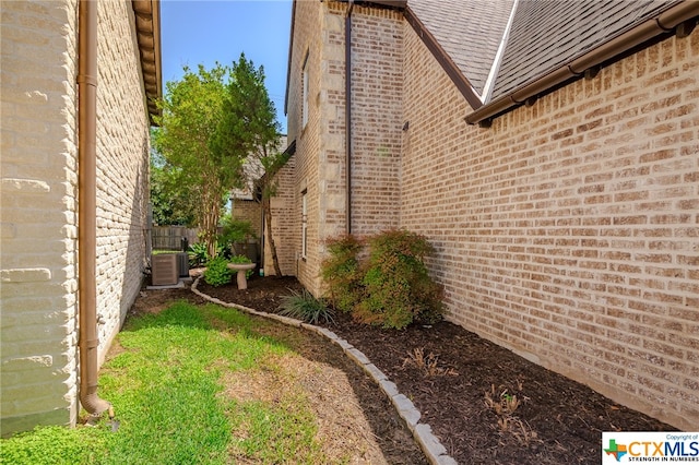 view of side of home with cooling unit