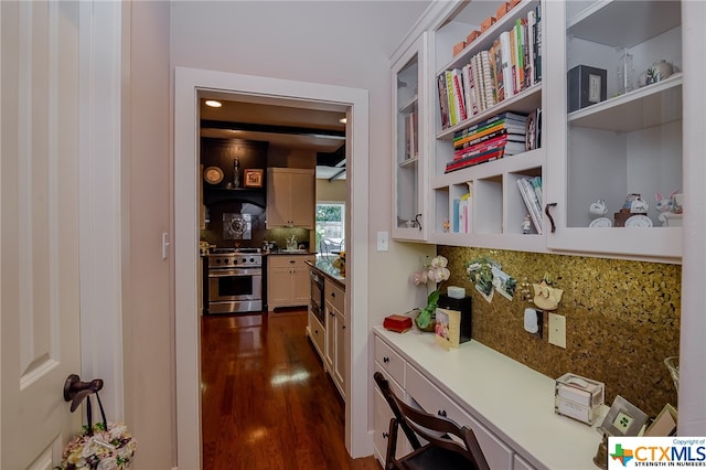 corridor with dark hardwood / wood-style floors