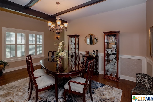 dining space featuring a notable chandelier, dark hardwood / wood-style floors, and beam ceiling