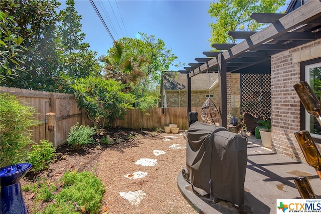 view of yard featuring a patio area and a pergola